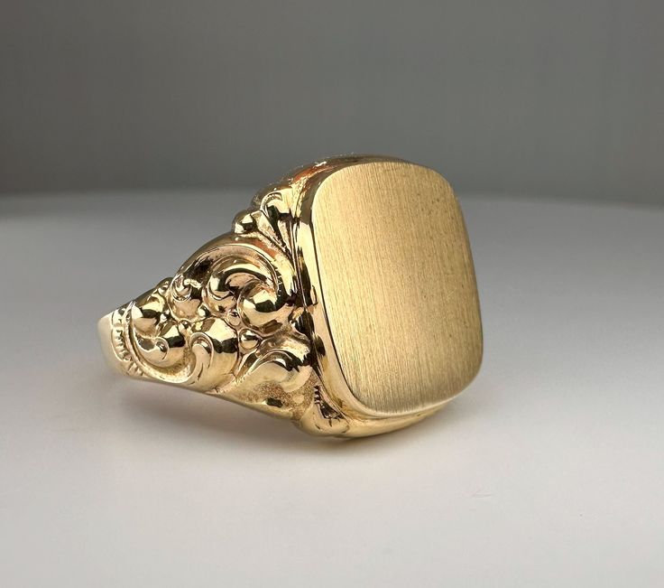 Wonderful vintage mid-century German men's signet ring, blank cartouche and ready to engrave with your initials, symbol, etc., massive 8k gold with two hallmarks (gold & maker's mark). The ring head has a decorative wreath on the side that emphasizes elegance, and a hefty 5 g weight. Material: 8k gold, hallmarked Total weight: 5 g US Size: approx. 12 (EU size 67) Box on the photos not included. PLEASE LOOK AT THE PICTURES, THEY ARE PART OF THE DESCRIPTION AND ARE THE ACTUAL ITEM YOU WILL RECEIVE German Men, Spinel Ring, Signet Ring Men, Wedding Anniversary Rings, German Silver, Aquamarine Rings, Wreath Decor, Gold Style, Signet Ring