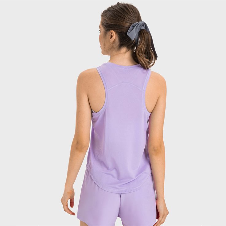 Cool and comfortable scoop neck racer back sleeveless top. Complete the look with a MB Yoga Matchmaker sports skirt. 92% Poly, 8% Spandex. High Stretch Racerback Tank Top For Light Exercise, High Stretch Racerback Tank Top For Training, Sportswear Tank Top For Running With Racerback, Sporty Solid Color Stretch Tank Top, Sporty Stretch Solid Color Tank Top, Breathable Fitted Racerback Tank Top, Fitted Breathable Racerback Tank Top, Stretch Sporty Tank Top, Moisture-wicking Stretch Racerback Tank Top