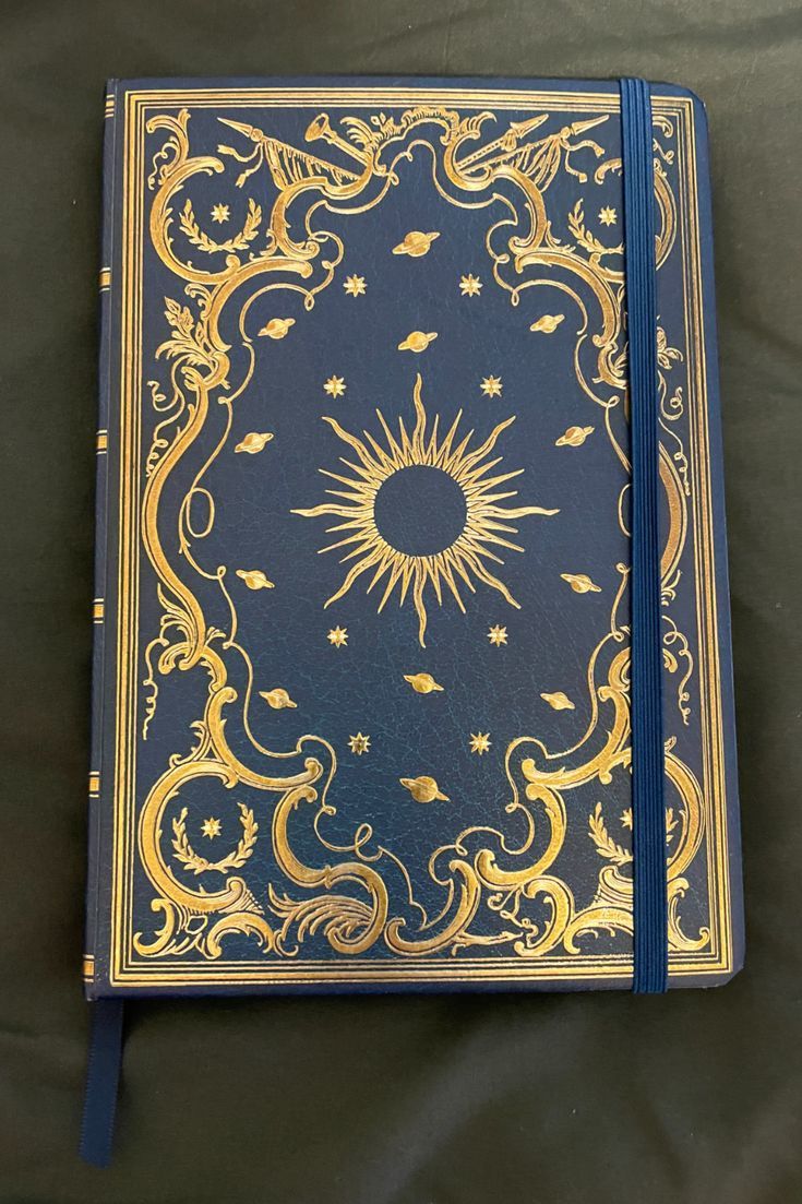 Beautiful celestial (Sun, planets, stars, etc.) gold foil journal with blue ribbon Planet Astrology, Celestial Journal, Book Rebinding, Press Ad, Book Cover Art Design, Peter Pauper Press, Binding Covers, Moon Reading, Book Cover Design Inspiration