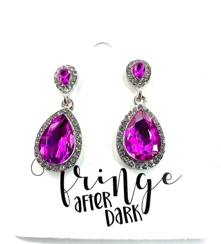 Crystal rhinestone dainty earrings Approximate length: 1.25" Stone color: purple, crystal Metal color: silver Back- Post back Nickel and lead compliant **Variance in computer monitors AND the lack of getting an exact match in person can make the color match tricky  I try to post several pictures at different angles to try to make this as easy as possible.   Feel free to ask any questions before purchasing if you are unsure about any details.  I'm happy to help. FINAL SALE- please check dimension Pageant Mom, Purple Dangle Earrings, Pageant Earrings, Earrings Purple, Purple Rhinestone, Purple Crystal, Loose Stones, Different Angles, Dainty Earrings