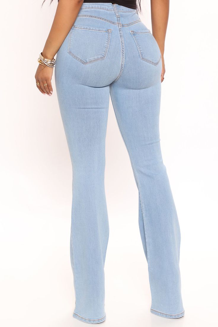 Our sexiest flare jean is offered in a range of washes in a high stretch, super soft fabric that hugs every curve. Fitted in the hips and thighs while flaring at the knee, these jeans elongate the legs and are perfect with a heel. Now offered in a range of washes, colors, and inseams. Available In Multiple Washes Petite 31" Inseam, Regular 34" Inseam, & Tall 37" Inseam High Stretch Denim 11.5" High Rise 22" Flare Leg Opening Faux Front Pockets Functional Back Pockets Disclaimer: Due To The Speci