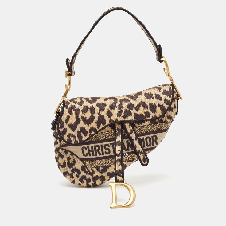 This bold Dior Saddle bag features a striking black and cream leopard print over the signature saddle silhouette. Paired beautifully with gold tone metal, the bag is an absolute stunner.Certified by The Luxury Closet - This item has gone through a detailed authentication process overseen by our experts. We offer a lifetime guarantee of authenticity on all our items. Import duties, taxes and charges are not included in the item price. These charges are the buyers responsibility. Please check with Dior 2021, Lv Purse, Lv Shoes, Dior Saddle, Embroidered Canvas, Dream Bags, Maria Grazia Chiuri, Girly Bags, Maria Grazia