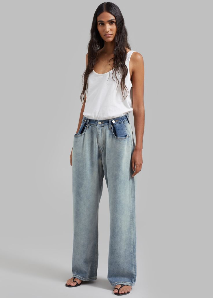 Color: Light Wash/Blue Midweight cotton denim Relaxed fit Wide leg High rise Darker tone contrast denim waist Adjustable button waistband Slant hip pockets Back patch pockets Zip fly Front button closure Unlined 100% Cotton Hand Wash in Cold Water Imported