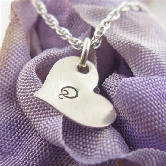 Airy and light: perfect for your little fairy or sprite. Personalize this itty bitty, sterling silver heart charm that measures approximately 13mm across (TINY!) and holds up to 4 characters. Her little silver heart will dangle sweetly next to her very own genuine freshwater pearl charm - tinkling as she twirls around. ♥ Please note that each letter is individually hand-stamped onto this piece. The letters will not be perfectly aligned due to the nature of the technique used to create this piece Silver Personalized Cute Heart Necklace, Cute Personalized Silver Heart Necklace, Personalized Silver Heart Necklace In Cute Style, Whimsical Personalized Charms For Gifts, Cute Silver Charm Necklaces, Cute Silver Pendant Charm Necklace, Cute Silver Charm Necklace For Valentine's Day, Cute Silver Charm Necklace With Heart Charm, Cute Sterling Silver Charm Necklace