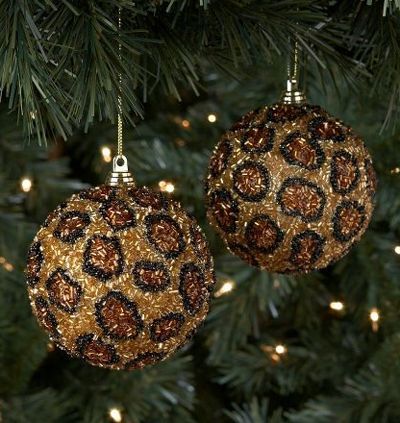 two ornaments hanging from a christmas tree