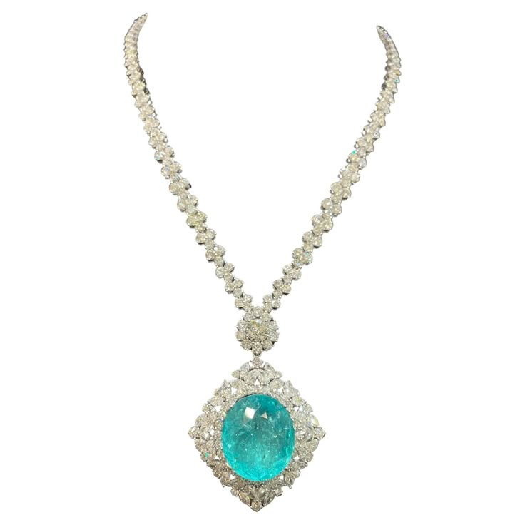 The Following Items we are offering is a Rare Important Gorgeous 18KT White Gold Glittering Diamond and Paraiba Tourmaline Necklace!!!! Necklace features Outstanding Multi Shaped Shimmering Gorgeous Extremely Rare Fancy Oval Cut Large Paraiba Tourmaline and adorned with Fancy Glittering Marquise, Pear and Round Cut Full Cut Diamonds!!! T.C.W. Approx 45CTS!!! NWT Original Retail $525,000. Comes with a Certified Gemological Certificate. A Rare Spectacular Masterpiece!!! Paraiba Tourmaline Necklace, Expensive Necklaces, Teal Accessories, Expensive Jewellery, Teal Jewelry, Princesa Real, Real Diamond Necklace, Diamond Pendants Designs, Paraiba Tourmaline