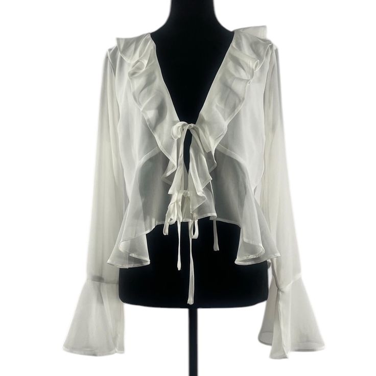 Lulus White Chiffon Ruffled Long Sleeve Tie-Front Top,Large, Nwt Effortless Elegance Discover The Perfect Blend Of Sophistication And Femininity With This White Chiffon Ruffled Long Sleeve Tie-Front Top. Crafted From Lightweight Chiffon, This Exquisite Piece Offers A Sheer Yet Modest Coverage, Creating An Enchanting Allure That Is Both Stylish And Comfortable. The Delicate Ruffles Cascading Down The Sleeves Add A Touch Of Romance, While The Tie-Front Design Allows For A Customizable Fit, Ensurin Dk Photoshoot, 25 Aesthetic, Elegant Skirts, White Flowy Top, Flowing Blouse, Flowy Shirt, Brunch With Friends, Spring 2025, Flowy Sleeves