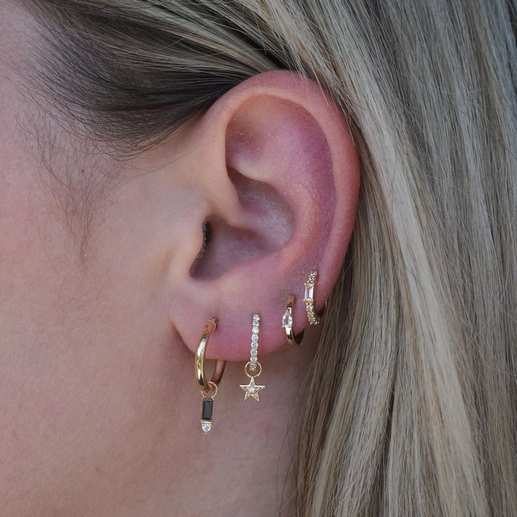 Our 14k Dainty Diamond Huggies are the perfect addition to your ear stack, seamlessly fitting into both earlobe and cartilage piercings. Their versatile design effortlessly transitions from casual to formal, adding a touch of elegance to any look Whether worn alone for a touch of sophistication or paired with other earrings for a stylish stack, this huggie hoop is a timeless treasure that adds a subtle sparkle to any look. Did we mention our 14k Hoop Charms can be seamlessly added on to them? So Dainty Huggie Diamond Earrings For Pierced Ears, Everyday Huggie Diamond Earrings With Accents, Dainty Diamond Dangle Huggie Earrings, Gold Diamond Accented Huggie Cartilage Earrings, Gold Stackable Huggie Cartilage Earrings, Diamond Huggies, Hoop Charms, Ear Stack, Pearl Collection