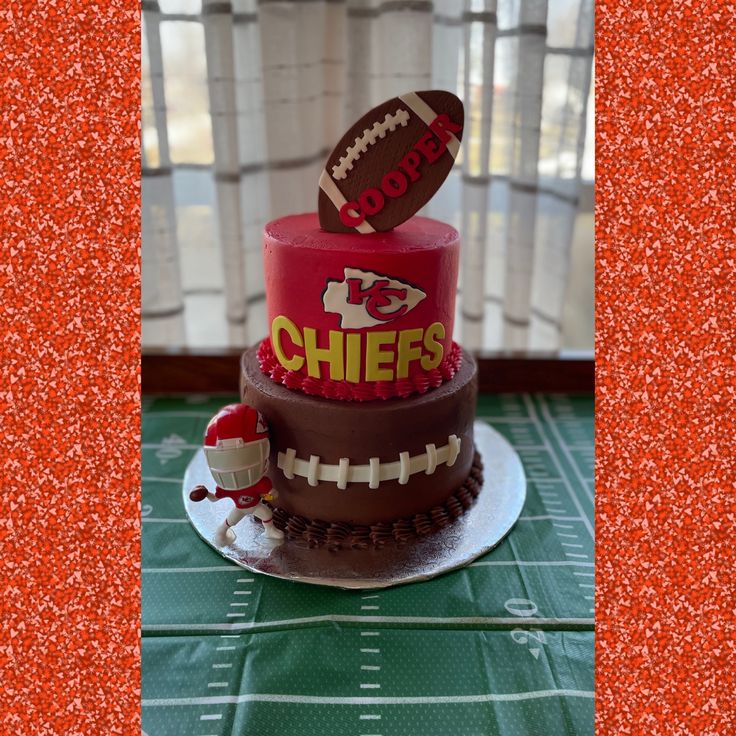 a football themed cake on top of a table