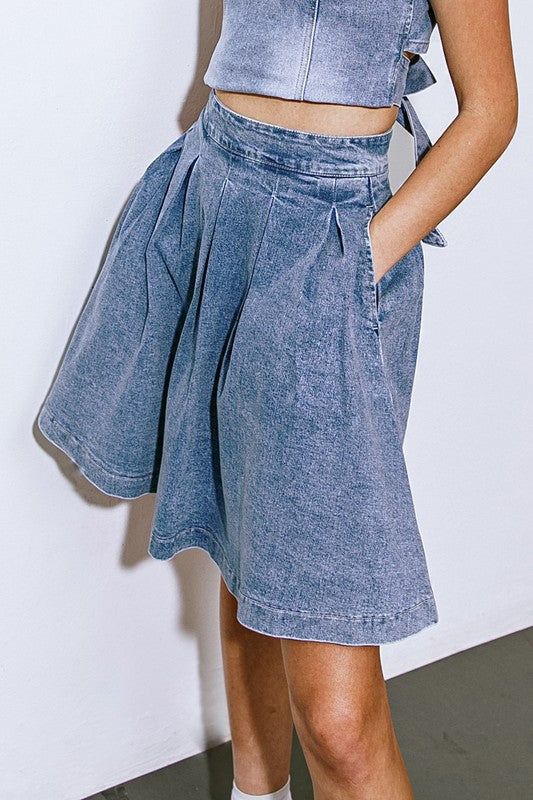 Washed denim midi skirt, featuring full skirt with pleats and back zipper closure. Pair with our washed denim top (Style #FT1025) for the complete denim look!