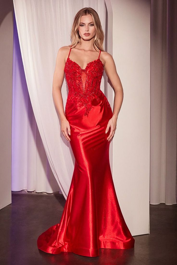 The Claire Gown is perfect for your next event! Indulge in the allure of our glitter satin mermaid dress, a captivating ensemble suitable for any occasion. Its figure-hugging mermaid silhouette is adorned with stretch satin glitter fabric, ensuring both glamour and comfort. The mesmerizing design features a plunging neckline, sheer lace-appliquéd bodice, and striking open crisscross back. The sleek satin skirt flows into a fit-and-flare silhouette, creating a graceful and polished look. Designed Beaded Corset, Fitted Gown, Fitted Gowns, Cinderella Divine, Stunning Prom Dresses, Sleeveless Gown, Corset Bodice, Mermaid Evening Dresses, Flowing Skirt