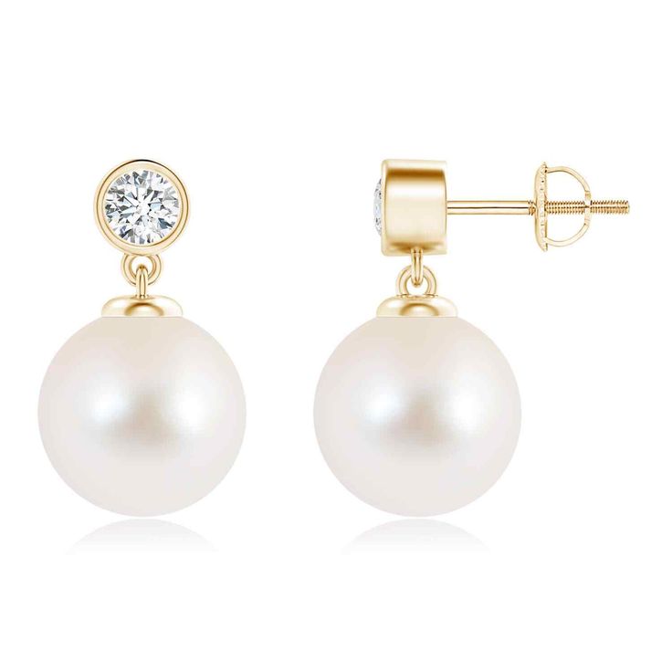 A fine quality Freshwater cultured pearls hangs elegantly below a brilliantly cut solitaire diamond in this exquisite pair of drop pearl earrings. Securely bezel set in 14k Solid gold, the diamond adds sparkle to these classic pearl earrings. Birthstone for the month of June and traditional gemstone gift for 3rd, 30th, 46th, 50th & 52nd wedding anniversaries. All our items are packaged with care in appealing boxes with plush interiors. Screw Back Closure Pearl Size is 10mm and 0.35 carat Diamond Timeless Brilliant Cut White Gold Pearl Earrings, Timeless White Brilliant Cut Pearl Earrings, White Gold Akoya Pearl Earrings With Pearl Charm, Pearl Earrings With Diamond Accents, Round Cut, Drop Pearl Earrings, Classic Pearl Earrings, Elegant 14k Gold-filled Pearl White Pearl Earrings, Freshwater Pearl Drop Earrings, Solitaire Diamond