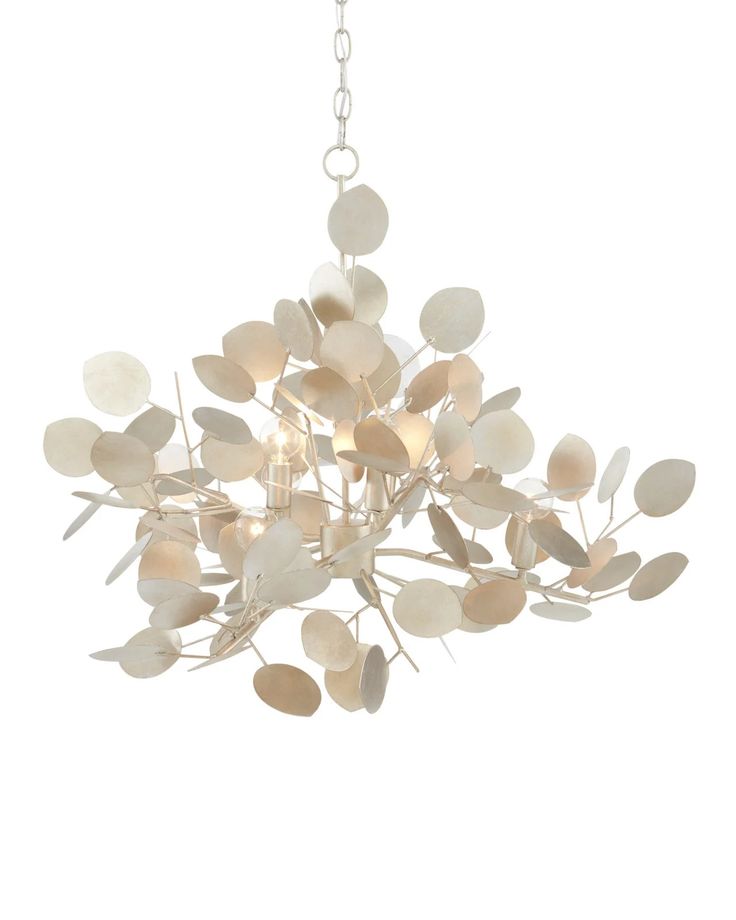 a white chandelier with leaves hanging from it