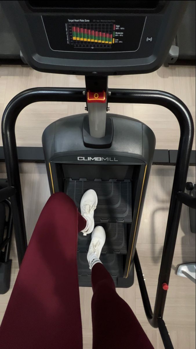 there is a person standing on the treadmill with their feet propped up in front of them