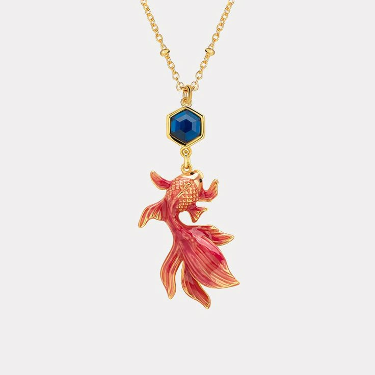 Selenichast Koi Pendant Necklace is a symbol for courage, overcoming adversity and strong character.This luxe Koi Necklace is a sophisticated piece of jewelry crafted with exquisite detail. Its unique enamel-coated design adds a hint of classic sophistication, sure to make you stand out with an air of luxury. DETAILS Plating: 18K Gold Materials: 18K Gold on brass, Enamel Measurements: Length: 16.54"(42cm) + Extender: 2.36"(6cm) Pendant Size:1.38''*0.63''(3.5cm*1.6cm) Weight: Symbol For Courage, Koi Necklace, Gold Pendant Necklace Jewellery, Necklace Gift Ideas, Lucky Necklace, Diamond Star Necklace, Anchor Jewelry, Star And Moon Necklace, Luxury Details