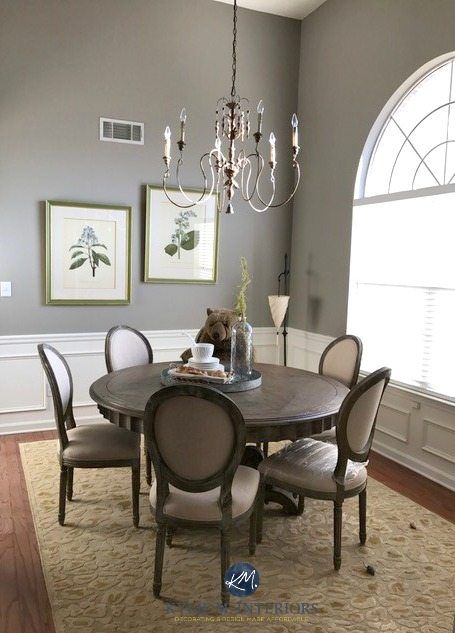 a dinning room table with chairs and chandelier