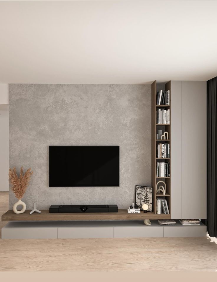 a living room with a large tv mounted on the wall