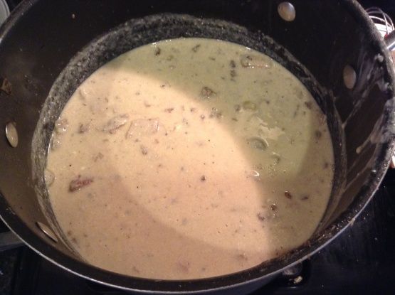 a pot filled with soup sitting on top of a stove