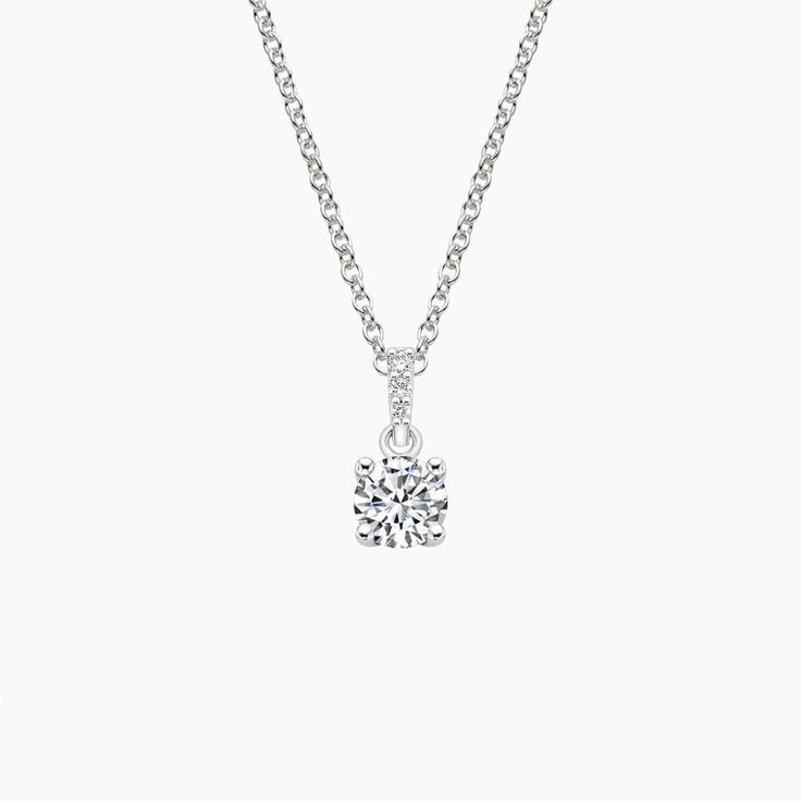 Pavé Diamond Bail Pendant - 18K White Gold. A beautiful center gem is elegantly held in a four prong basket attached to a bail glittering with pavé set diamond accents. Luxury Silver Diamond Solitaire Necklace, Dazzling Moissanite Solitaire Necklace For Formal Occasions, Luxury White Gold Solitaire Necklace For Formal Occasions, Exquisite White Gold Diamond Necklace With Brilliant Cut, Timeless Formal Jewelry With Lab Grown Diamonds, Refined Lab Grown Diamond Jewelry For Formal Occasions, Refined Formal Jewelry With Lab Grown Diamonds, Luxury Solitaire Necklace With Prong Setting, Classic White Diamond Necklace With Pave Setting