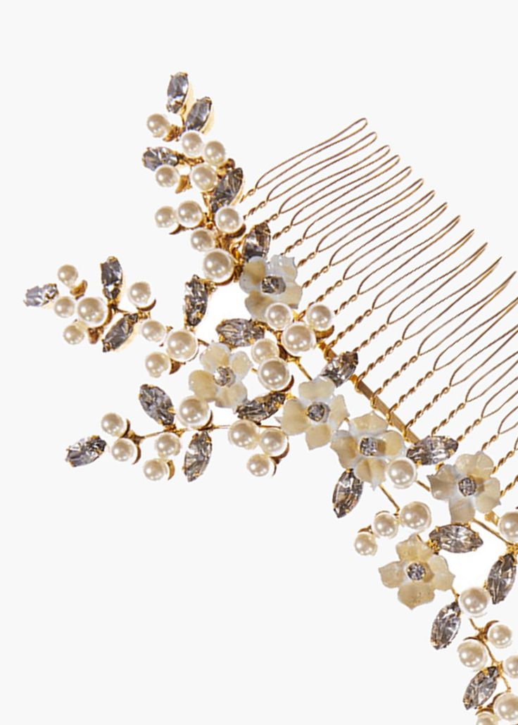 The Persephone Comb is inspired by the work of Botticelli: rife with pearls, botanicals, and femininity. This piece is a one-of-a-kind work of art, combining delicate Swarovski pearls, leaf-shaped Swarovski crystals that are set by hand, and flowers that are painted by hand in our Brooklyn studio. The shape recalls a sprig of wildflowers effortlessly tucked into the hair; the Persephone Comb can be worn with a veil to complete a bridal look. Dimensions: 6 x 3.5 inches Weight: 44g Luxury Hair Accessories, Luxury Hair, Swarovski Pearls, Bridal Look, Leaf Shapes, Bridal Looks, Comb, Veil, Swarovski Crystals