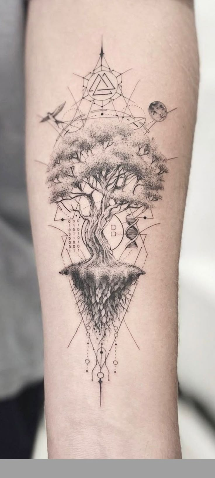 a person with a tree tattoo on their arm