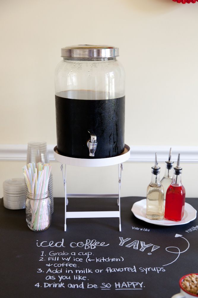 a black and white coffee maker sitting on top of a table