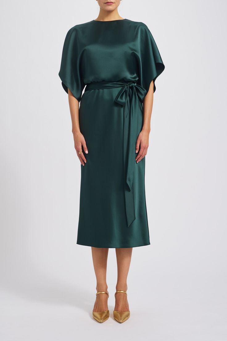 Fluid satin dolman sleeve bias midi dress. Shown in Hunter. Chic Silk Maxi Dress With Cape Sleeves, Formal Green Silk Midi Dress, Green Silk Bias Cut Midi Dress, Green Silk Midi Dress With Bias Cut, Silk Dress With Draped Sleeves For Dinner, Silk Dinner Dresses With Draped Sleeves, Satin Dress With Draped Cape Sleeves, Silk Maxi Dress With Draped Sleeves For Dinner, Elegant Viscose Midi Dress With Draped Sleeves