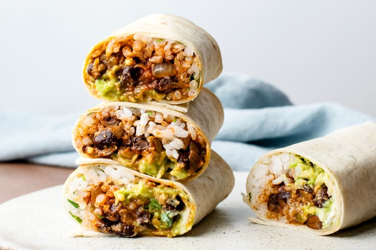 three burritos stacked on top of each other