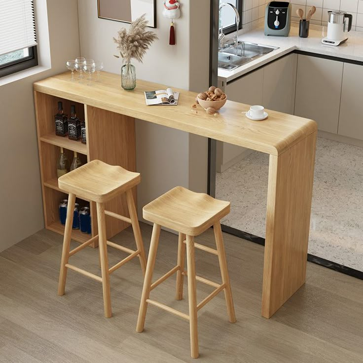 two stools sit at the counter in this modern kitchen