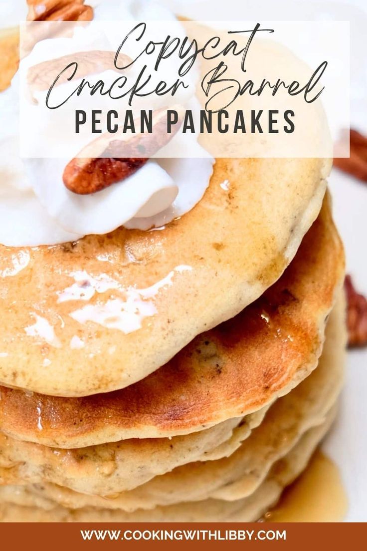 stack of pancakes topped with whipped cream and pecans