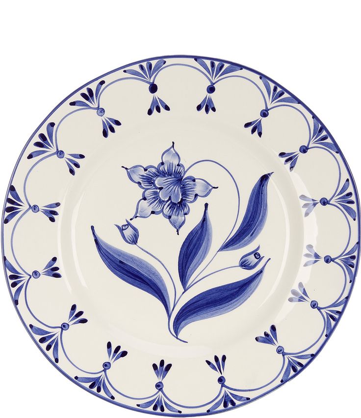 a blue and white plate with flowers on it