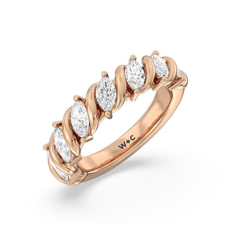 a rose gold ring with five diamonds