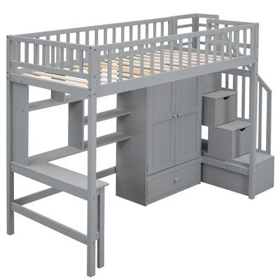 a gray loft bed with desk underneath it