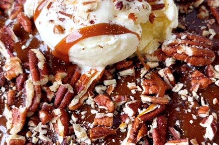 pecans and ice cream are on top of chocolate