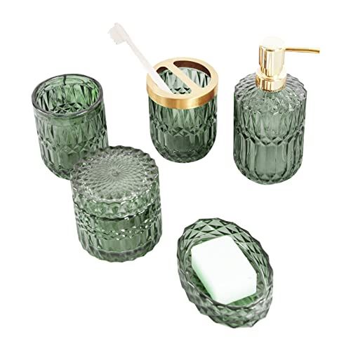 green glass bathroom accessories including soap dispenser, toothbrush holder and tumbler