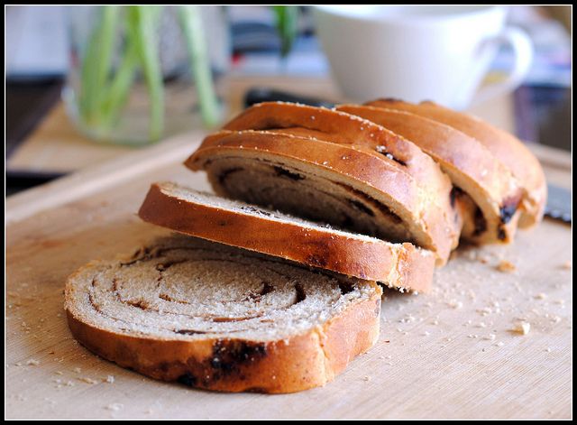 sliced loaf of bread sitting on top of a cutting board