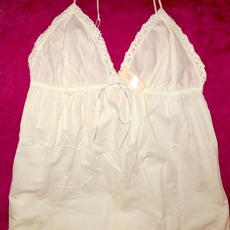 Cotton White With Embroidered Trim Of White Lace With Baby Blue Ribbon And Straps Spring White Cotton Sleepwear, White Cotton Sleepwear For Spring, White Cotton V-neck Sleepwear, White Cotton Sleepwear For Summer, Spring V-neck Camisole For Bedtime, Feminine White Cotton Camisole, Feminine White Tops For Loungewear, Cotton V-neck Top For Bedtime, Summer Cotton Sleepwear With Spaghetti Straps