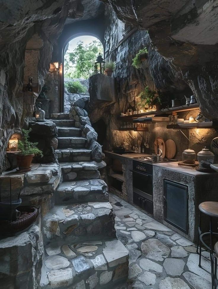 an outdoor kitchen with stone steps leading up to it