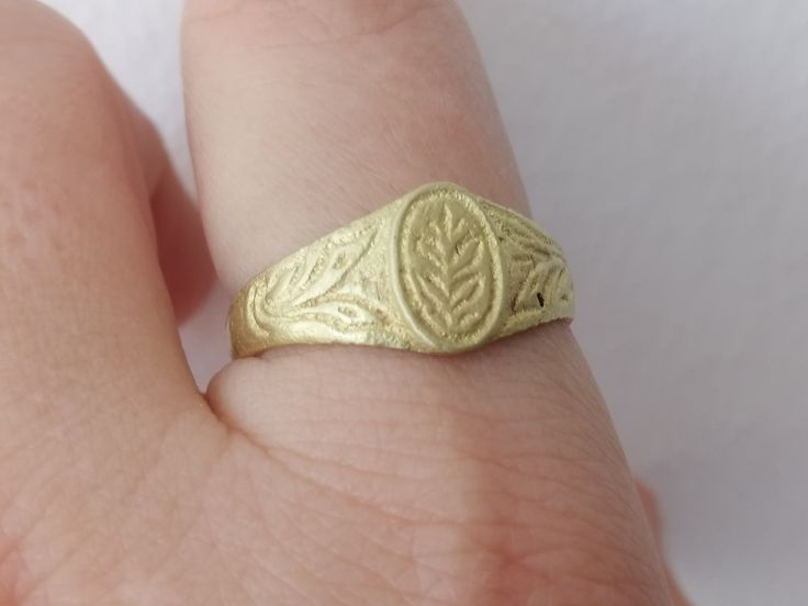 Unique handwork broze ring from Macedonia of 1800s, which came in rarely good condition. The ring is hand carved with beautiful floral ornament. It has size 10 (the US size) or 20 mm diameter - more like large women size or men size. Thevring had a strong patina, ehich I mostly cleaned (left some inside of the ring). Also you can see a sign of metal checking, made by somebody - from inside of the ring. This is not visible, when the ring is on finger. Rare and beautiful gift from old Balkans. Ceremonial Antique Rings With Antique Finish, Antique Etched Rings For Ceremonial Occasions, Victorian Style Etched Rings For Ceremonial Occasions, Victorian Style Ceremonial Etched Engraved Ring, Antique Hand-cast Signet Ring For Gift, Antique Hand Cast Signet Ring For Gift, Antique Gold Ceremonial Signet Ring, Antique Gold Engraved Ceremonial Ring, Antique Gold Engraved Ring With Historical Design