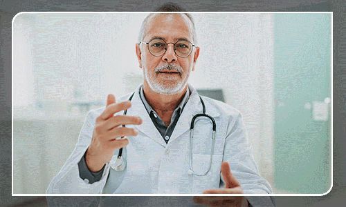 a man in a white lab coat is talking to someone with a stethoscope