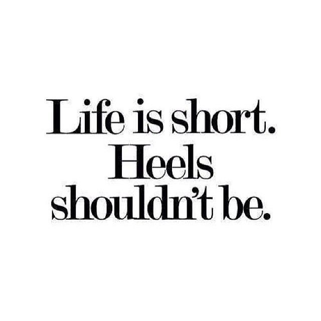 the words life is short, heels shouldn't be written in black on a white background