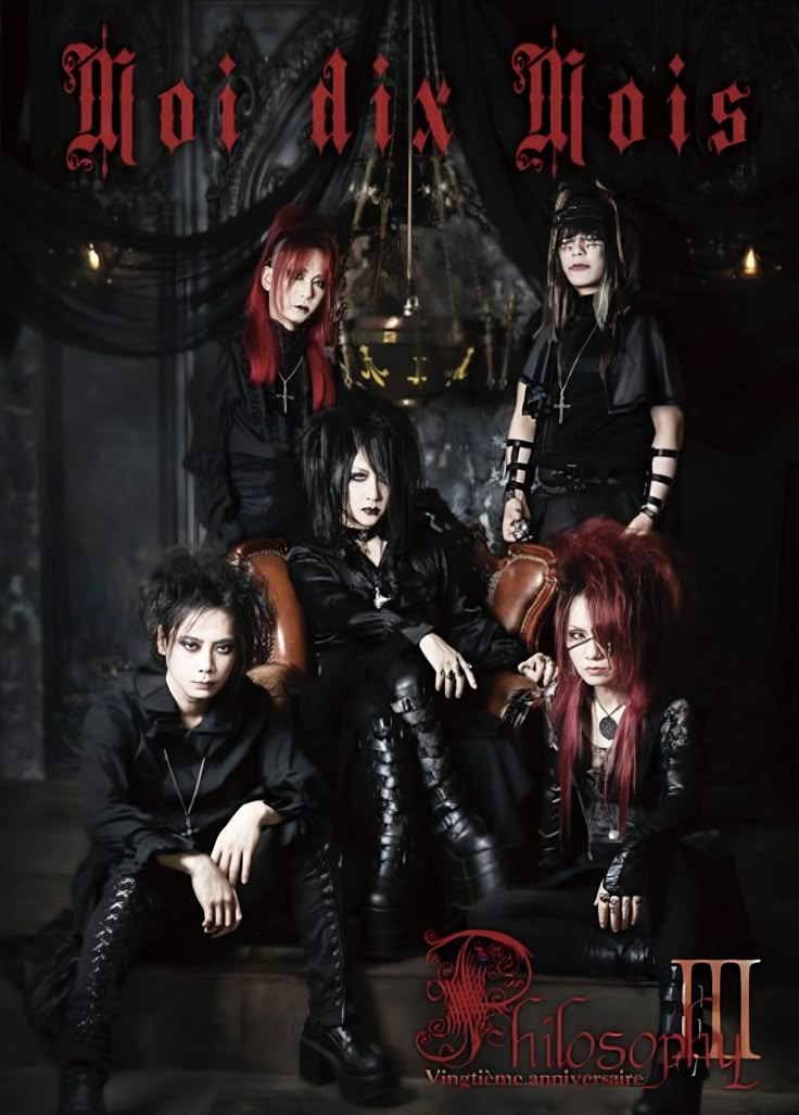 the band motleys posing for a photo in their black leather outfits and red hair