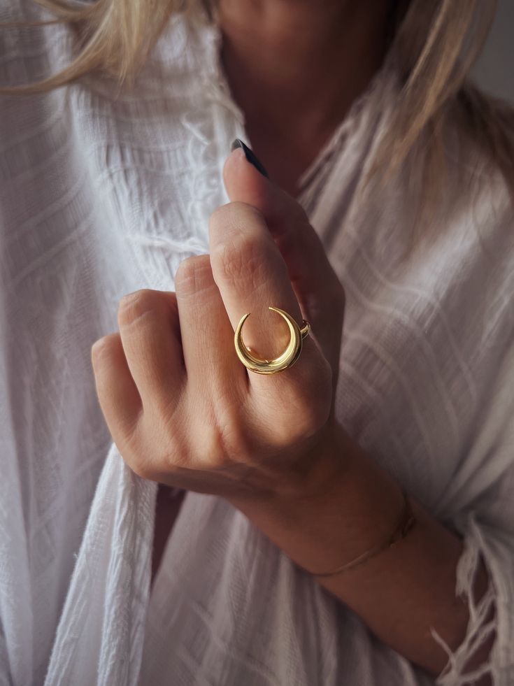 This ring is a piece from Keras collection.Sculptured and casted in solid sterling silver 925 and then double gold plated with 22k gold.Very nice and important weight. The crescent is 20mm (0.787 inch)  All of my jewelry is handmade please allow for small variances from piece to piece ,as this is a feature of owning one of a kind original handmade jewelry.  Feel free to ask me for personal orders . -22k gold platted Sterling silver 925 You may also like on bright silver  https://www.etsy.com/lis Mystical Open Ring Promise Ring, Adjustable Crescent Moon Phase Ring, Minimalist Crescent Moon Charm Ring, Elegant Crescent Moon Charm Rings, Celestial Style Open Ring With Moon Charm, Adjustable Rings With Moon Charm, Adjustable Moon Shaped Gold Ring, Gold Crescent Ring With Sun And Moon Design, Adjustable Moon-shaped Gold Ring