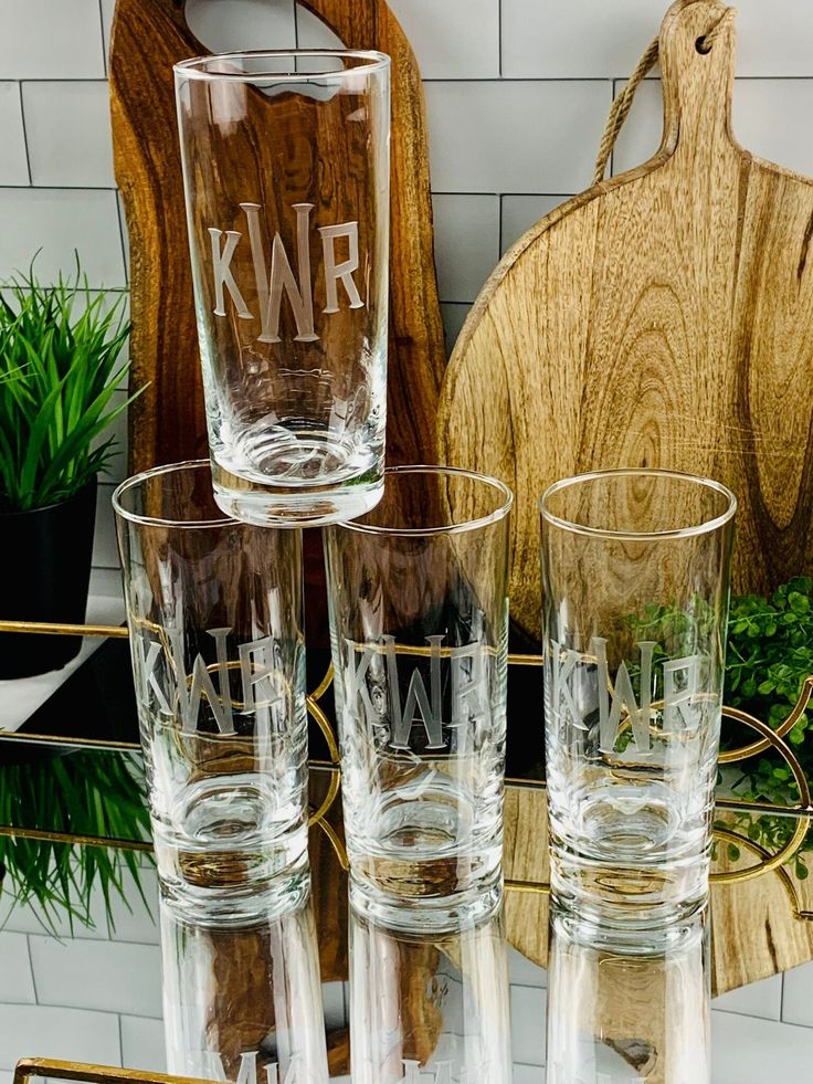 four glasses sitting next to each other on a table