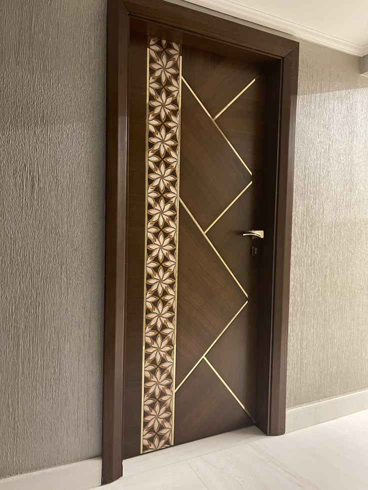 an open door with decorative designs on the front and side panels, in a room