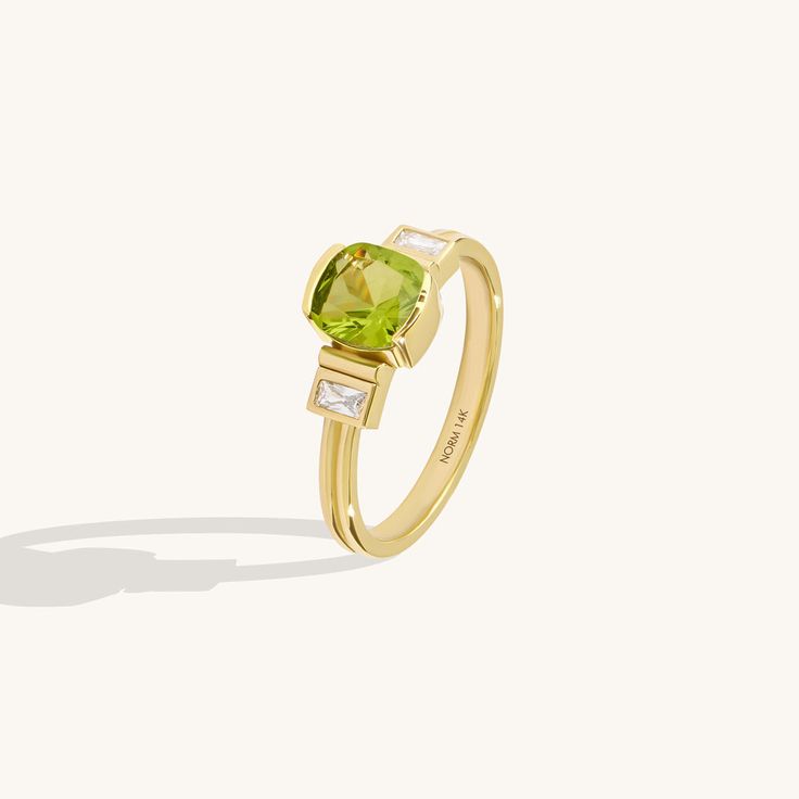 Art Deco Peridot Ring in 14K solid gold, featuring a captivating cushion-cut lab-grown peridot gemstone. Elevate your style with vintage charm. Free shipping. Elegant Peridot Diamond Ring, Elegant Peridot Diamond Ring With Center Stone, Elegant Lime Green Gemstone Rings, Luxury Yellow Gold Peridot Rings, Yellow Gold Peridot Rings With Gemstone Accents, Elegant Lime Green Ring With Center Stone, Elegant Lime Green May Birthstone Ring, Elegant Lime Green Birthstone Rings, Elegant Peridot Ring With Center Stone