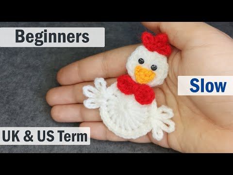 a hand holding a small crocheted chicken in it's palm and the words beginners slow written below