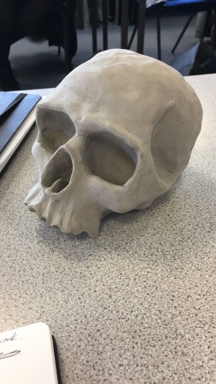 a fake human skull sitting on top of a table