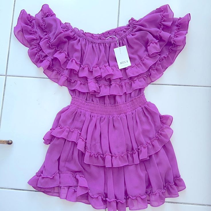 Never Worn, Tags Still On - Adorable Yet Sexy Magenta Dress. Detailed With Layered Ruffles And A Band Around The Waist To Enhance Your Curves. Purple Mini Dress For Summer Cocktail, Chic Purple Ruffle Dress With Ruffle Hem, Chic Lavender Dress With Ruffle Hem, Purple Cocktail Mini Dress For Summer, Summer Cocktail Purple Mini Dress, Lavender Ruffled Dress For Party, Lavender Ruffled Party Dress, Fitted Purple Ruffle Dress For Party, Lavender Party Dress With Ruffles