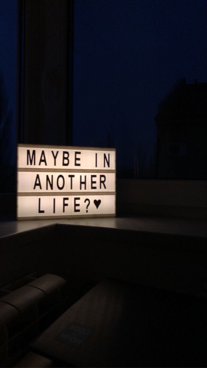 a lighted sign that says maybe in another life?